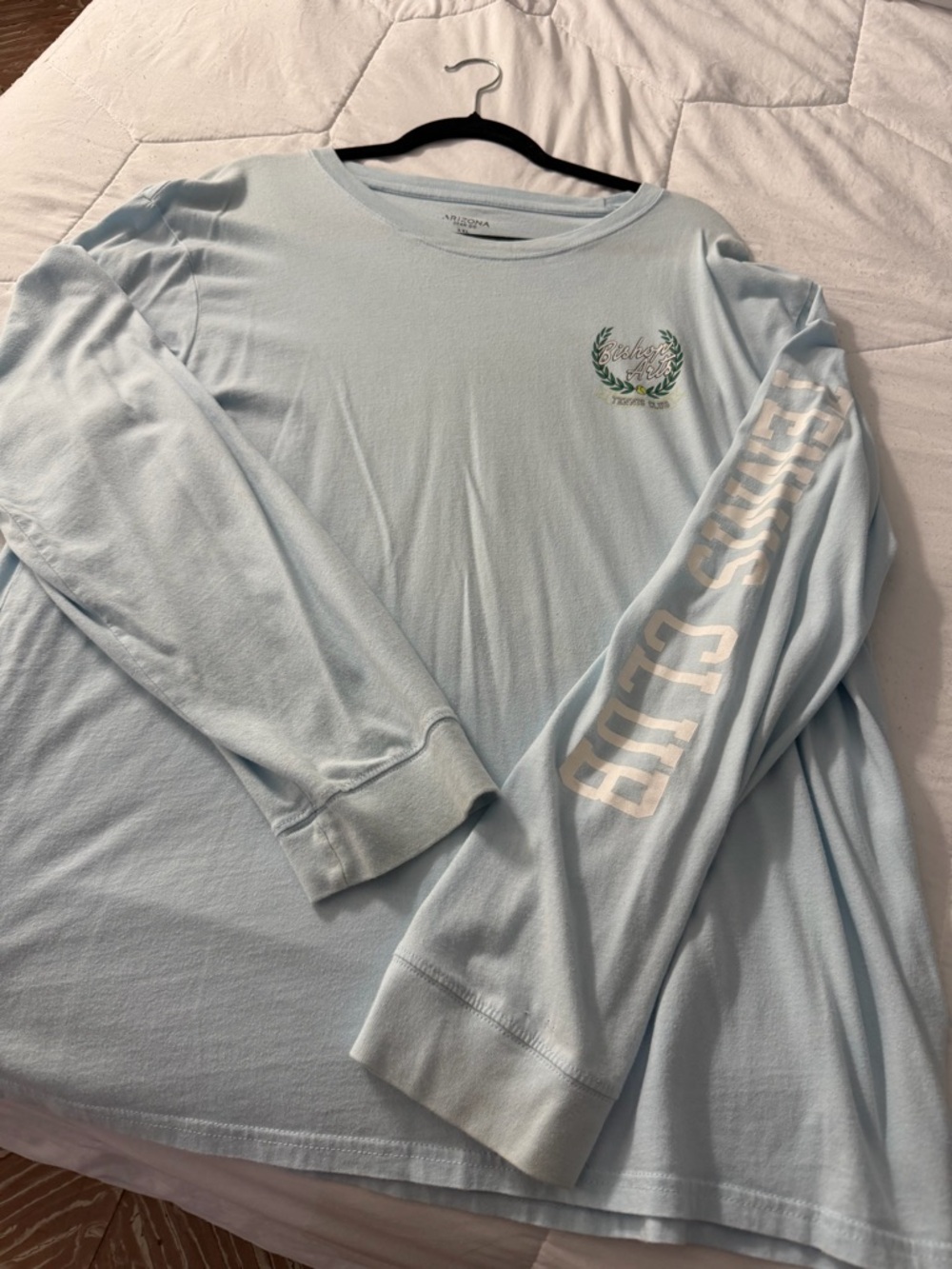 Light Blue Long Sleeve Graphic Tee with Chest Emblem